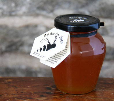 A jar of Made by Bees amber coloured honey
