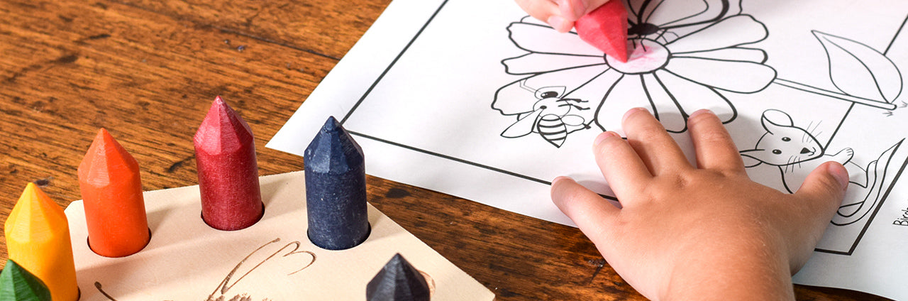 A child colouring using all-natural beeswax crayons.